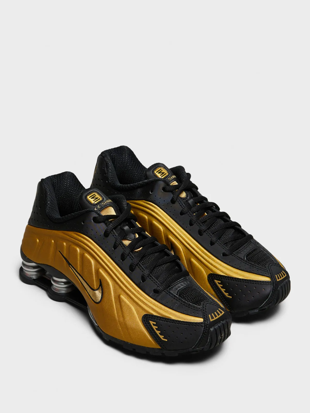 Shox R4 Sneakers in Black and Metallic Gold
